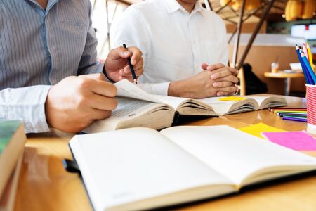 education and school concept, students campus helps Institution Friend catching up Reading and Exam and learning tutoring.の写真素材