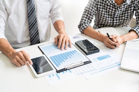 Business People Talking Discussing with coworker planning analyzing financial document data charts and graphs in Meeting and  successful teamwork Conceptの写真素材