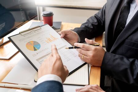 Business Team Investment Entrepreneur Trading discussing and analysis data the stock market charts and graphs negotiation and research budget, teamwork tradersの写真素材