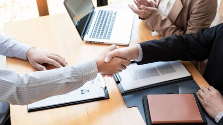 businessman employee candidate shaking hands with company leader HR manager or boss in office after successful negotiation, recruitment  career and placement interview conceptの写真素材