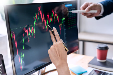 Business Team Investment Entrepreneur Trading discussing and analysis data the stock market charts...