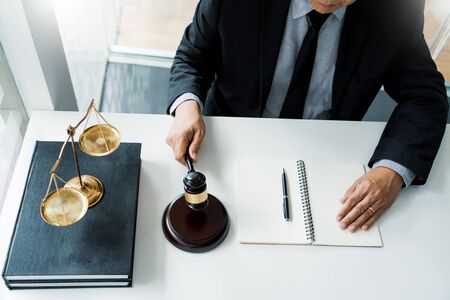 The private office workplace for consultant an young lawyer legislation with gavel and document on wood tableの写真素材