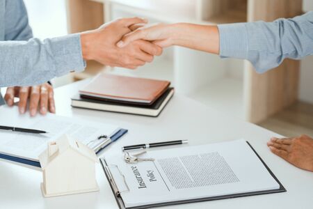 client customer handshake together for successful deal to buy insurance services make sale purchase deal agreementの写真素材