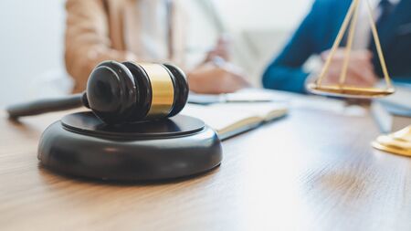 lawyer lawsuit notary consultation or discussing negotiation legal case with document contract women entrepreneurs in the office.の写真素材