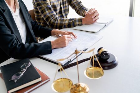 business people and lawyers discussing contract papers sitting at the table. Concepts of law  advice  legal servicesの写真素材