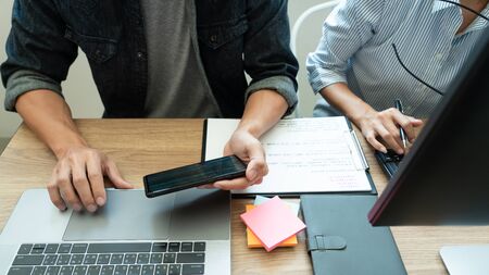 Collaborative work Software engineers website developer technologies or programmer working coding on startup ai application project on screen with partner in coworking space office companyの写真素材