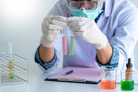 Scientist wear lab coat and protective wear are working with research or doing investigations with...