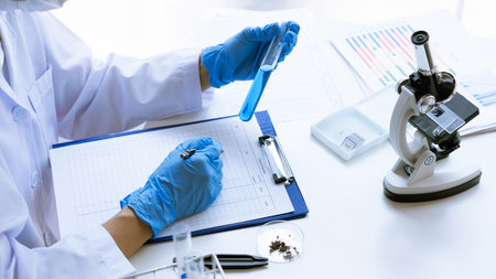 Scientist wear lab coat and protective wear are working with research or doing investigations with...