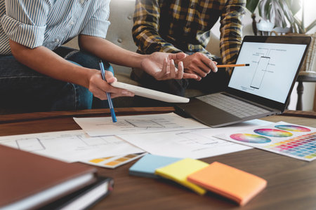 Creative team analyzing prototype products for product design in Coworking Space, teamwork...