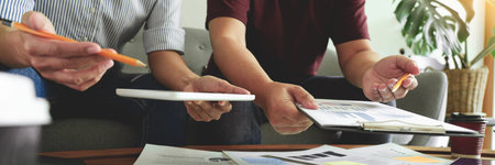 Business people writing on sticky notes for colleagues thinking strategy business plan or over...