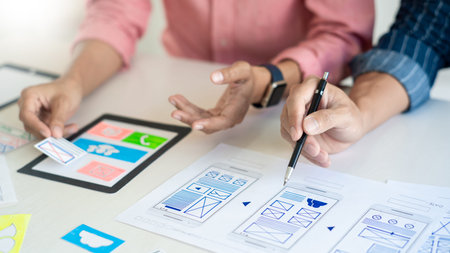 Team User experience (UX) designer creative graphic planning or designing application development a...
