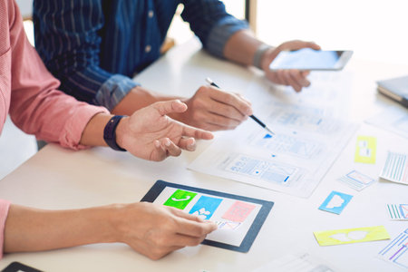 Team User experience (UX) designer creative graphic planning or designing application development a...