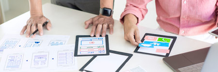 Team User experience (UX) designer creative graphic planning or designing application development a...