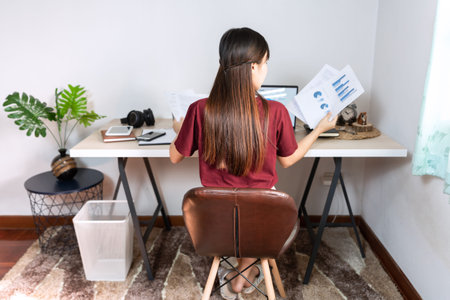 Attractive young beautiful asian woman Entrepreneur or freelancer working at home with laptop...
