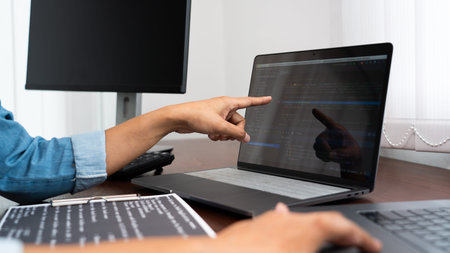 Software developer or programmer working data debugging improvement binary algorithm on desktop pc...