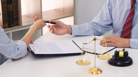 Professional Secretary lawyer working at his office signing contract Consultation of client from...