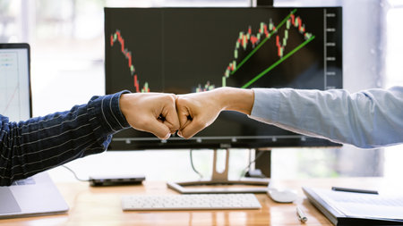 Colleagues Achievement Business Casual Fist bump together after dealing mission business, Business success and teamwork concept.の写真素材