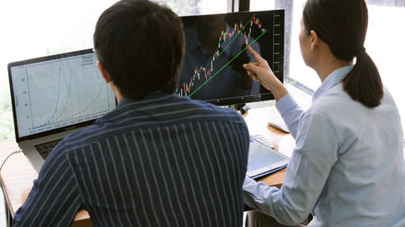 Team of stockbrokers are having a conversation on a stock exchange for investment purposes in...