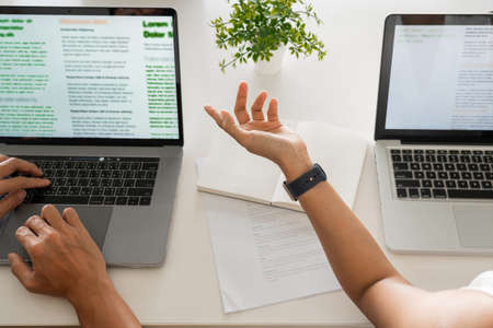 Young students campus helps friend catching up and learning tutoring. People, learning, education and school concept.の写真素材