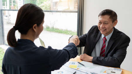 Colleagues Achievement Business Casual Fist bump together after dealing mission business, Business success and teamwork concept.の写真素材