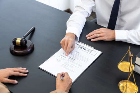 Lawyer or judge present client with contract document papers, Law and Legal services concept.の写真素材