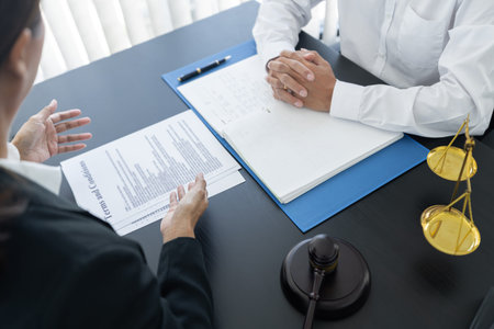 law,libra scale and hammer on the table, 2 lawyers are discussing about terms and condition, law...