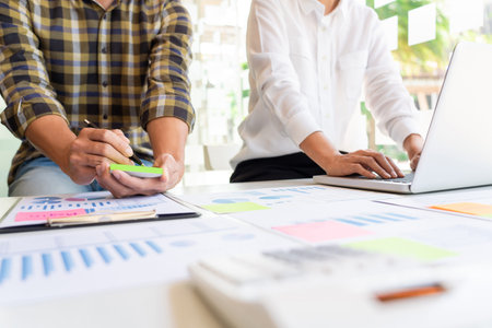young business managers crew working with new startup project working with plan on office desk and...