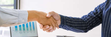 handshaking of agreement to make a contract starting new financial business.の写真素材
