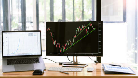A monitor displaying the dynamic of real estate stock chart in the first quarter.の写真素材