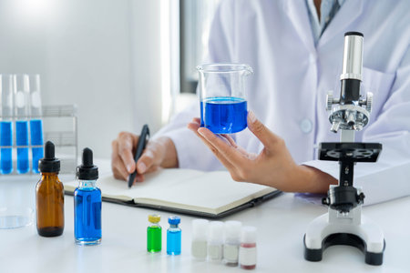 Scientist wear lab coat and protective wear are working with research or doing investigations with...