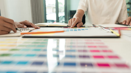 two designers discussing on the color tone for the excellent visual work.