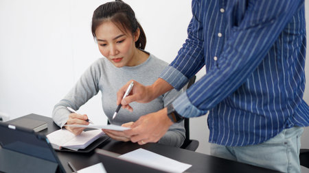 Office work concept a smart businessman offering an idea about the marketing strategies to his...
