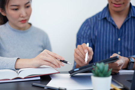 Office work concept a businessman showing a bar graph presenting interesting information of a new...