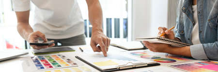 both coworkers designing some products choosing the appropriate shade.の写真素材