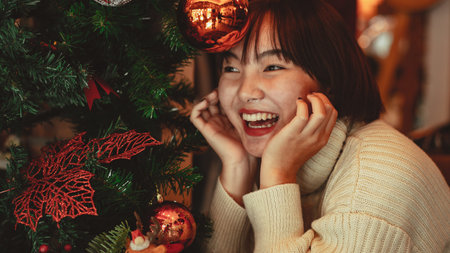winter holidays concept, Happy woman Decorating Christmas tree for New Year celebration