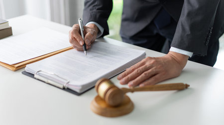 law concept. the legal officer standing and concentrating on reading the legislative conditions...