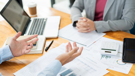 Business negotiation concept the male real estate broker negotiating his point to the female...