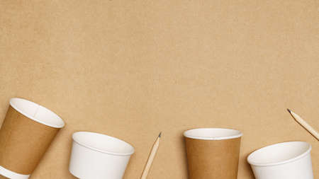 Eco friendly concept, Consist of paper cup and pencil with cotton buds on wooden background.の写真素材