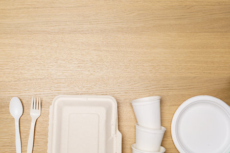 Eco friendly concept, Food container set and paper cup of biodegradable on wooden background.