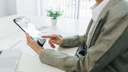 Confidence woman concept, Businesswoman use tablet to checking business data to analyzing strategy.