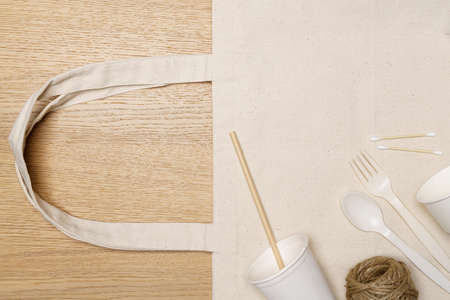 Eco friendly concept, Eco bag with food container and jute rope on wooden background.の写真素材