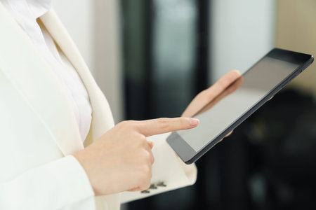 Confidence woman concept, Businesswoman using tablet to checking business plan and financial report.