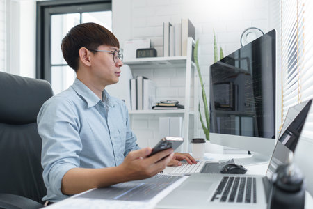 Software development concept, Male programmer check website programming on smartphone and computer.