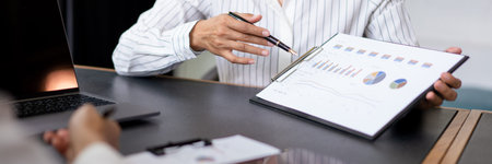Coworker business concept, Businesswoman pointing on document to discussing about project together.