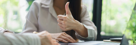 Coworker business concept, Businesswomen make great gesture for colleague after successful project.の写真素材