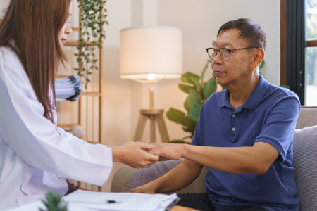 Health concept, Woman caregiver touch hand to encourage senior man after telling result of health.