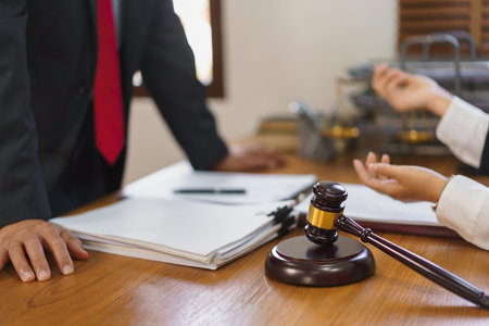 Legal and justice concept, Female lawyer shows contract to explains and consults with senior lawyer.