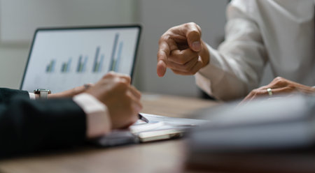 Business executive reading financial document and brainstorming about new startup project together.