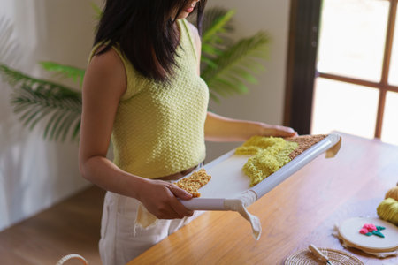 Hand embroidery concept, Women hold embroidery frame diy product making from punch needle technique.の写真素材