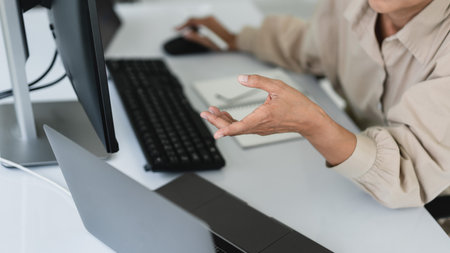 Developer programmer working to checking code on monitor while programming to developing website.の写真素材